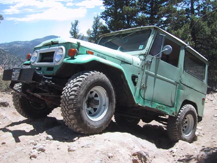 Jeff's Land Cruiser crawls over the first ledge